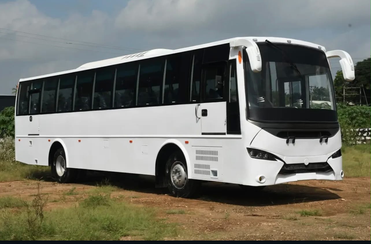 White long-haul coach body with tinted glass and moulded front fascia built by Alfha Coach Builders, Karur